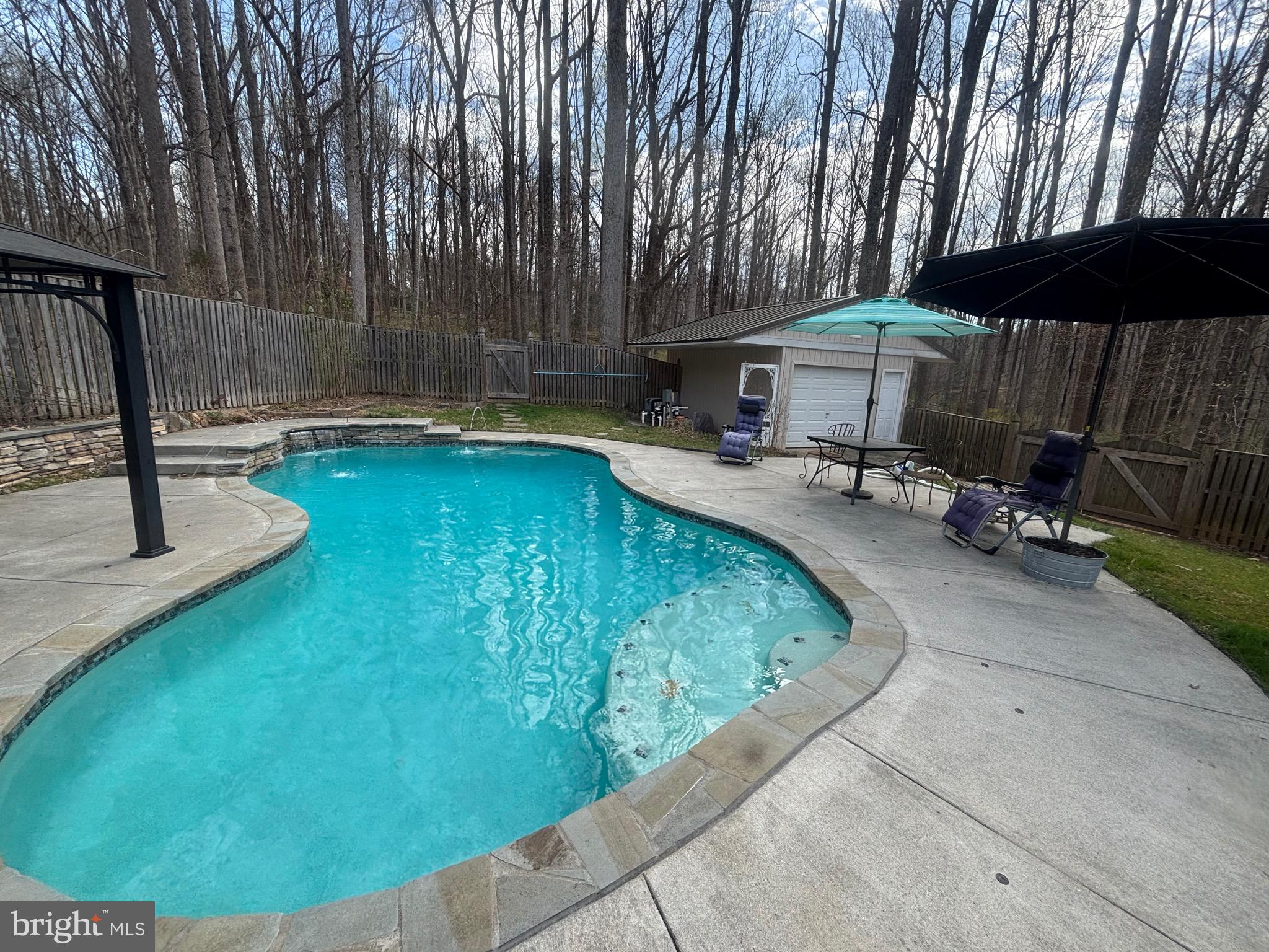 7491 Mink Hollow Road Highland, MD 20777 - Photo 61 of 67 a view of a swimming pool with sitting area and furniture