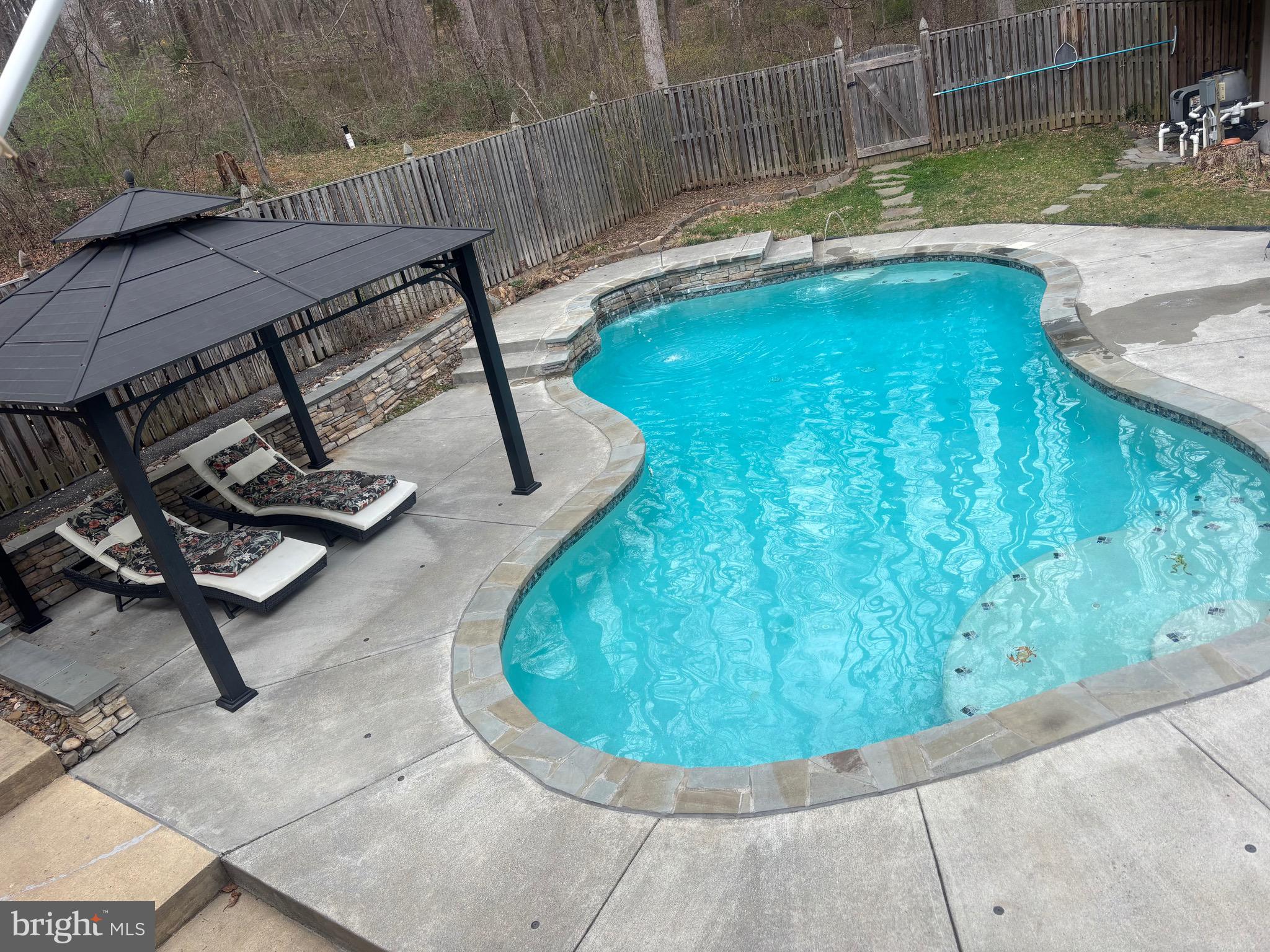7491 Mink Hollow Road Highland, MD 20777 - Photo 66 of 67 a view of a swimming pool with sitting area