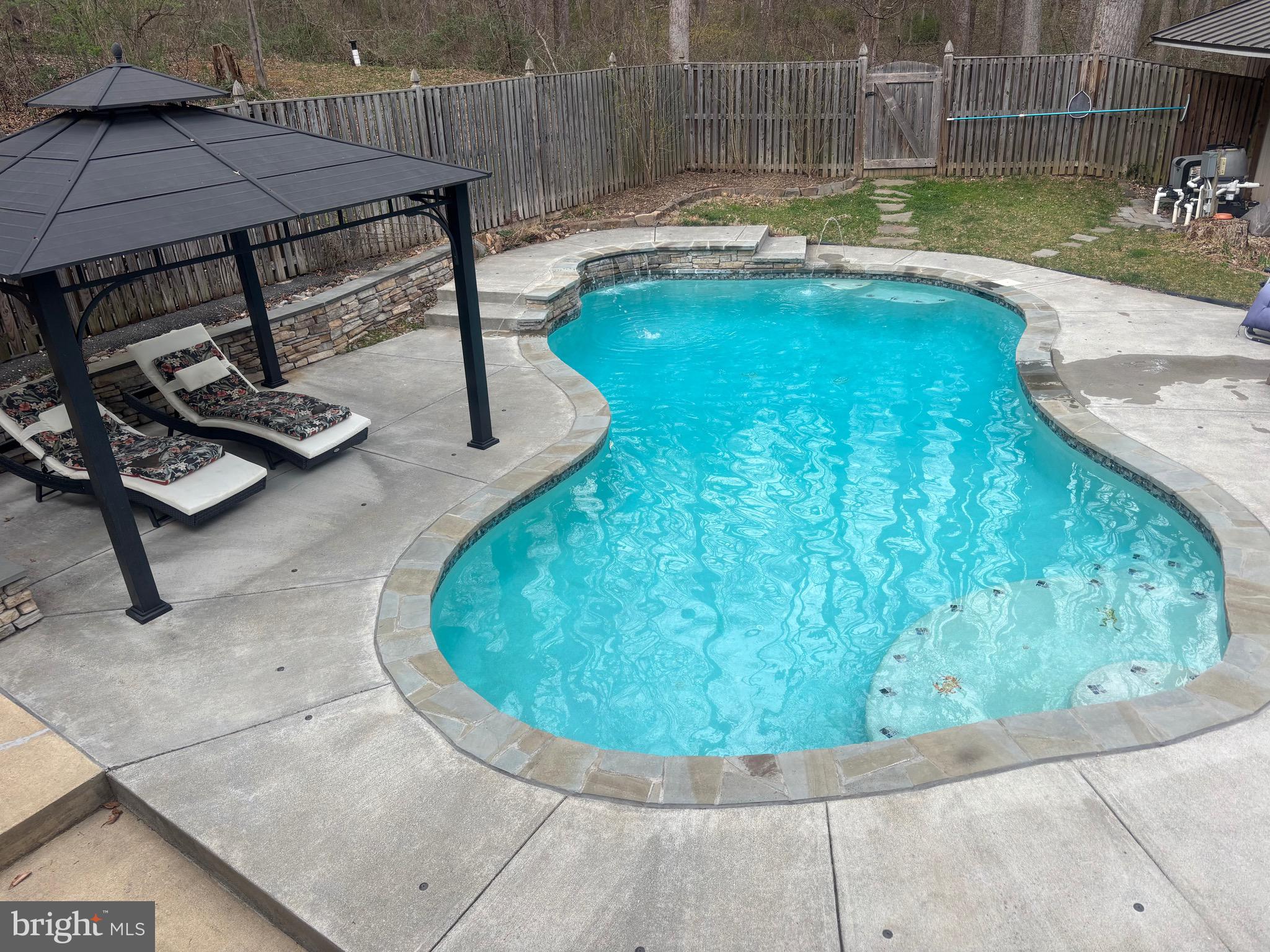 7491 Mink Hollow Road Highland, MD 20777 - Photo 67 of 67 a view of a swimming pool with a patio