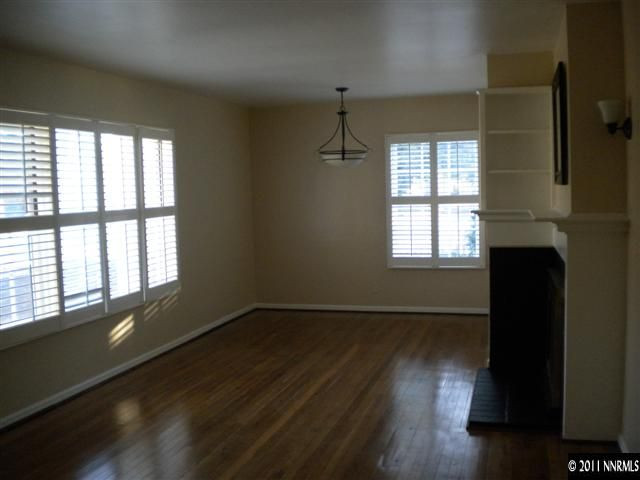 1720 Vale Street Reno, NV 89509 - Photo 11 of 13 a view of an empty room with wooden floor and a window