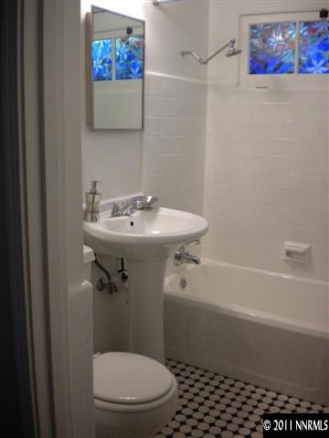 1720 Vale Street Reno, NV 89509 - Photo 5 of 13 a white toilet sitting next to a bath tub