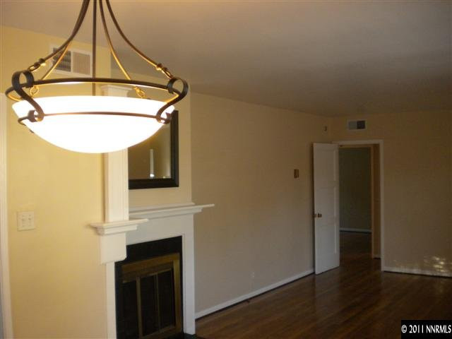 1720 Vale Street Reno, NV 89509 - Photo 9 of 13 a view of a hallway with wooden floor and a fireplace