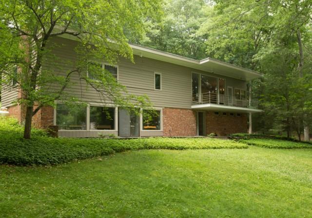 10 Rogues Ridge Road Weston, CT 06883 - Photo 1 of 1 a front view of a house with a yard