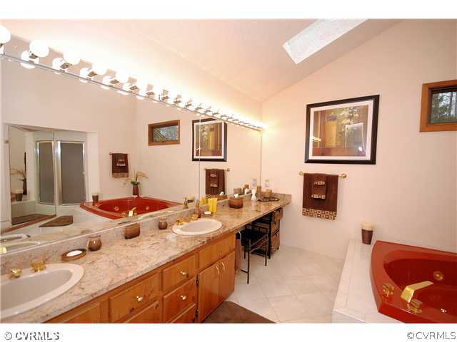 3303 Fortunes Ridge Road Midlothian, VA 23112 - Photo 7 of 12 a bathroom with a sink double vanity granite and a sink