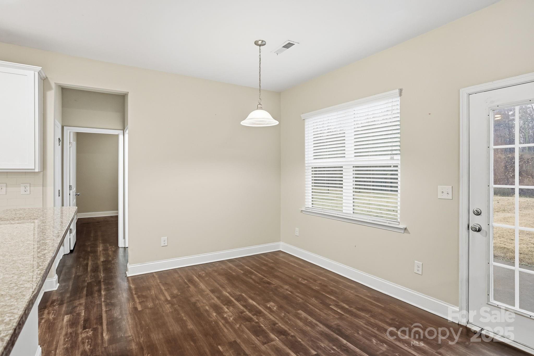 182 Sassafras Road Mooresville, NC 28115 - Photo 19 of 47 a view of a room with wooden floor and a window