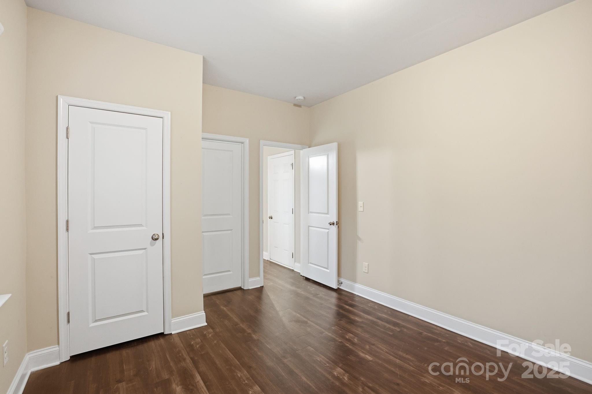182 Sassafras Road Mooresville, NC 28115 - Photo 21 of 47 a view of an empty room with wooden floor