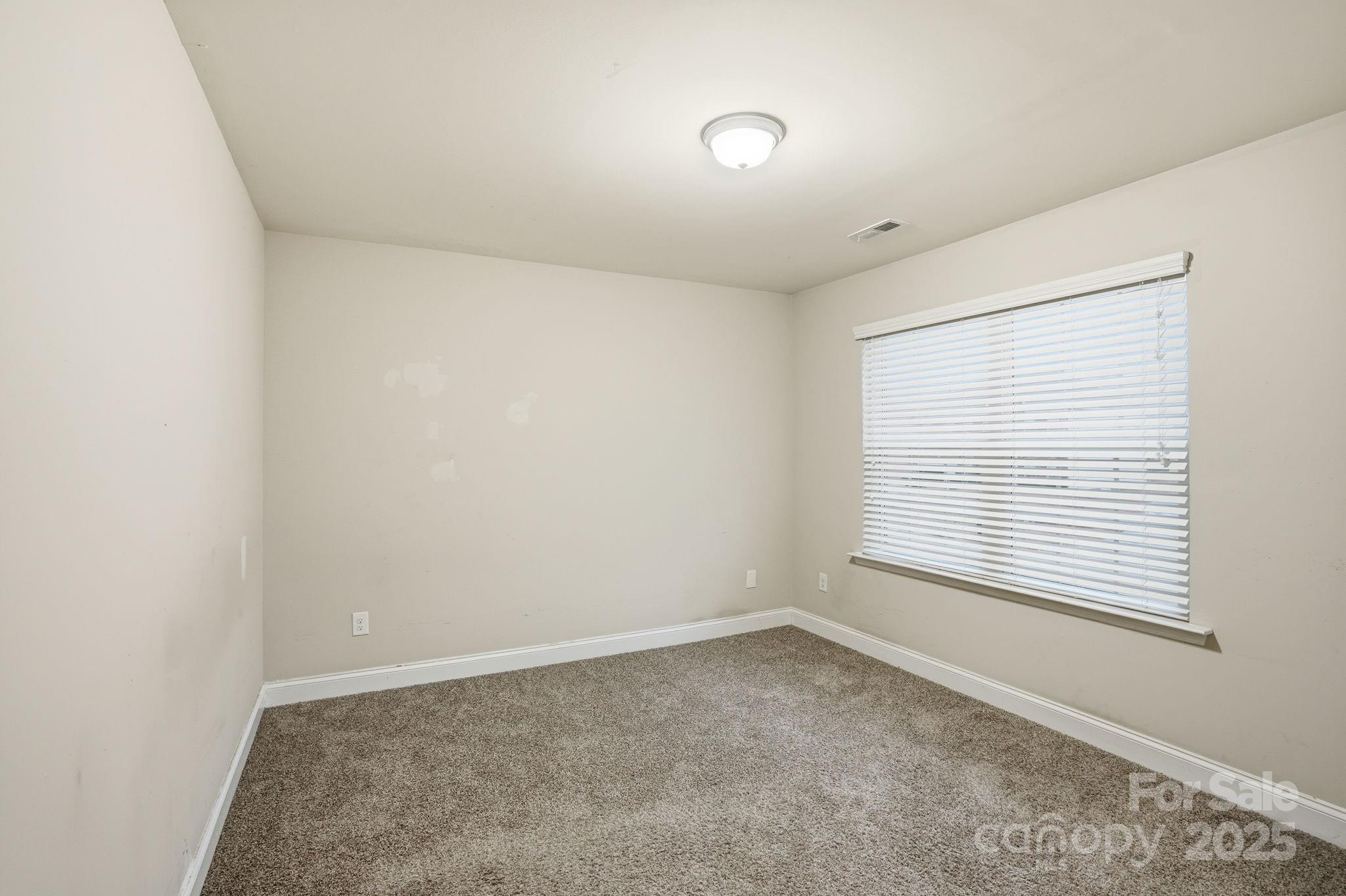 182 Sassafras Road Mooresville, NC 28115 - Photo 22 of 47 an empty room with a window