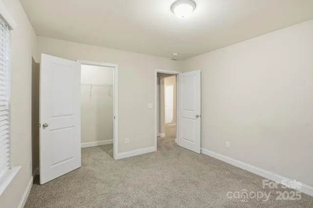 an empty room with closet area
