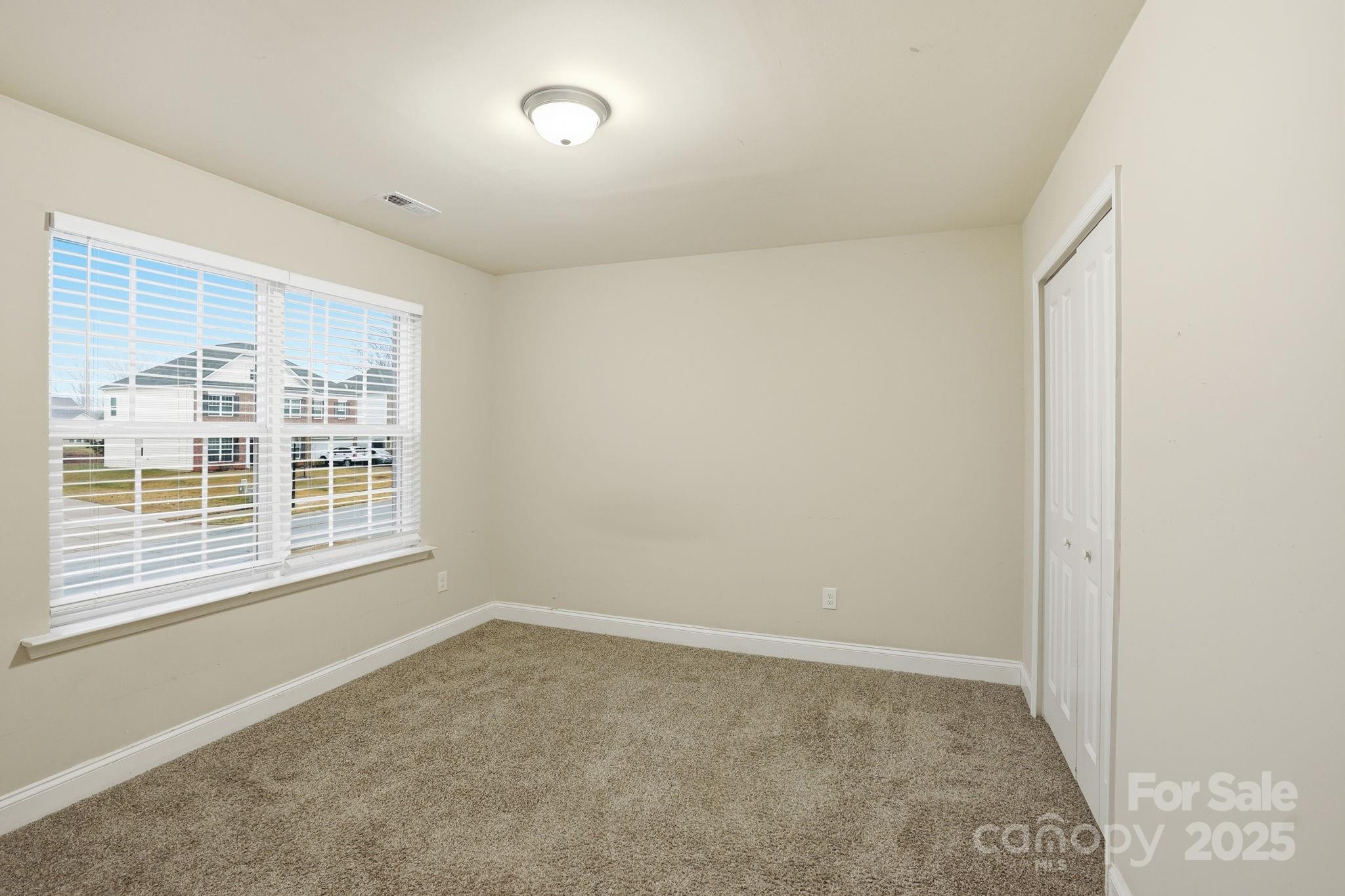 182 Sassafras Road Mooresville, NC 28115 - Photo 24 of 47 a view of an empty room with a window