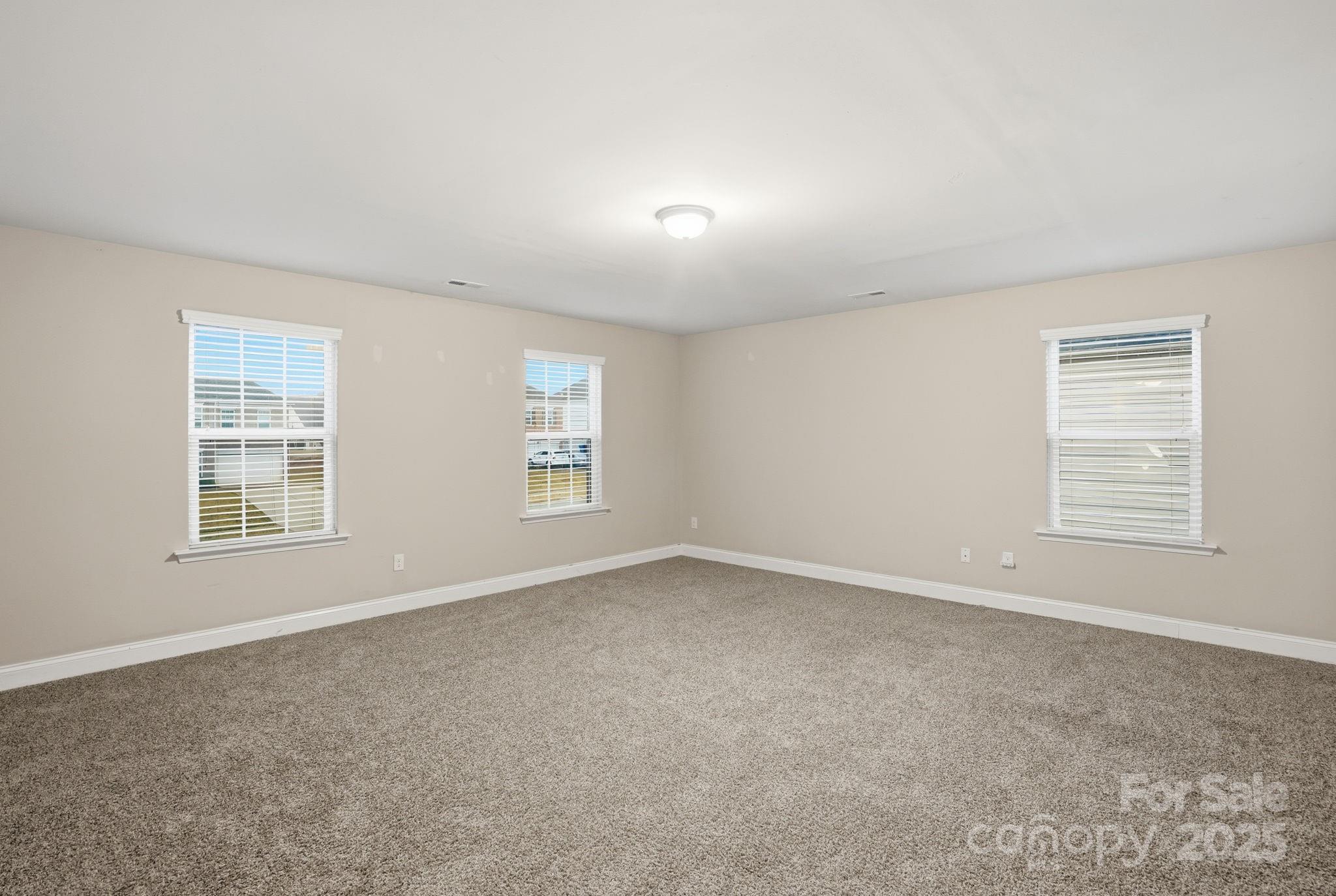182 Sassafras Road Mooresville, NC 28115 - Photo 26 of 47 an empty room with windows