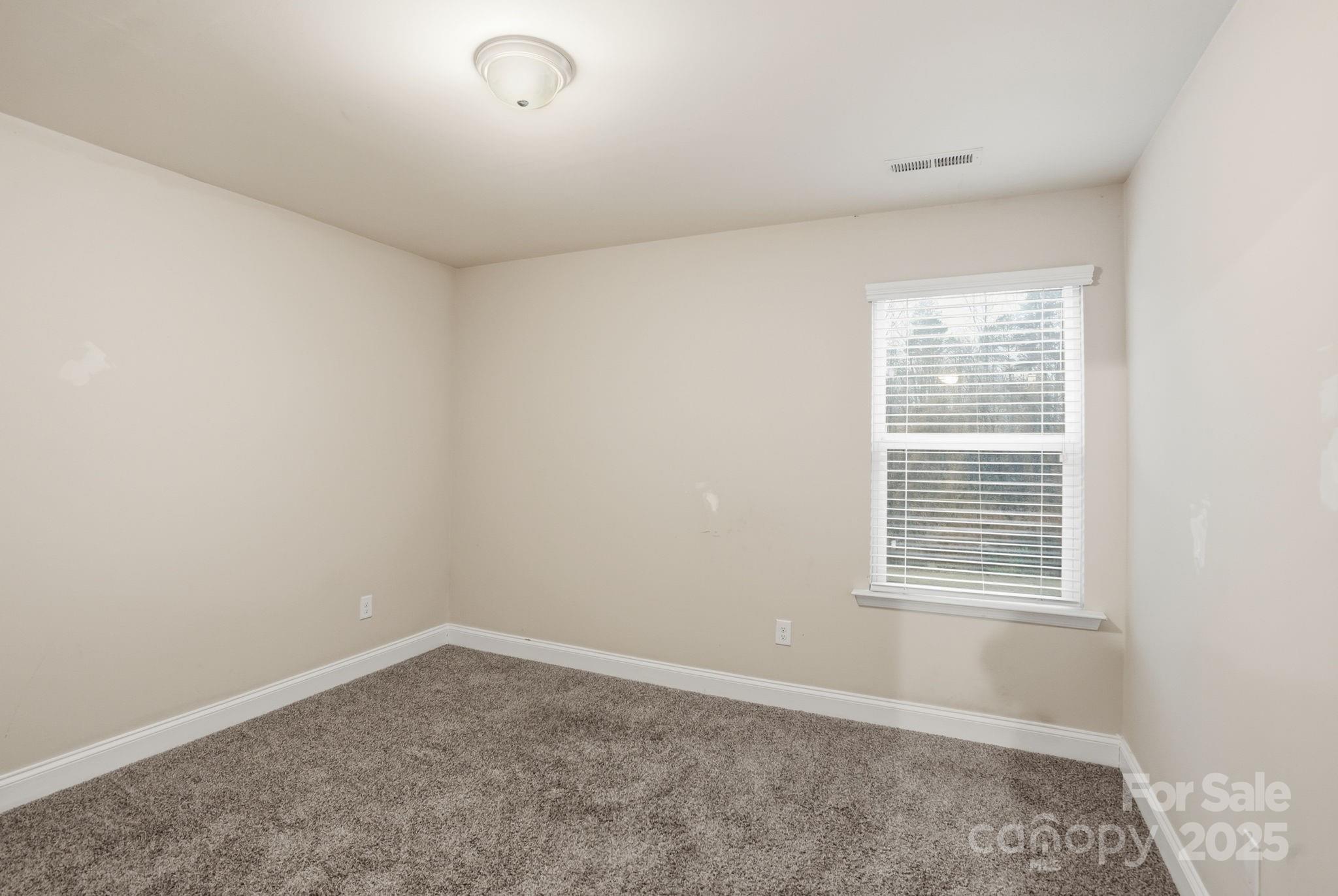 182 Sassafras Road Mooresville, NC 28115 - Photo 28 of 47 a view of an empty room with a window