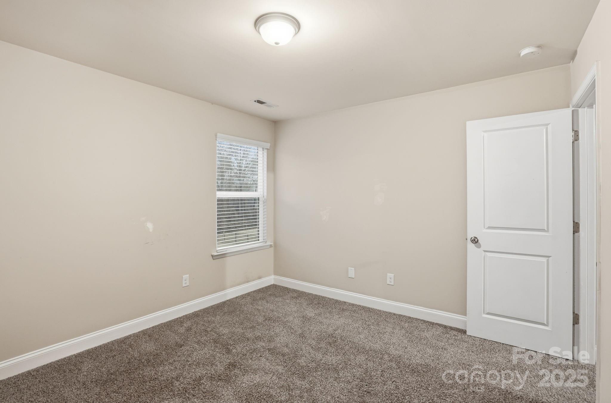 182 Sassafras Road Mooresville, NC 28115 - Photo 29 of 47 an empty room with windows