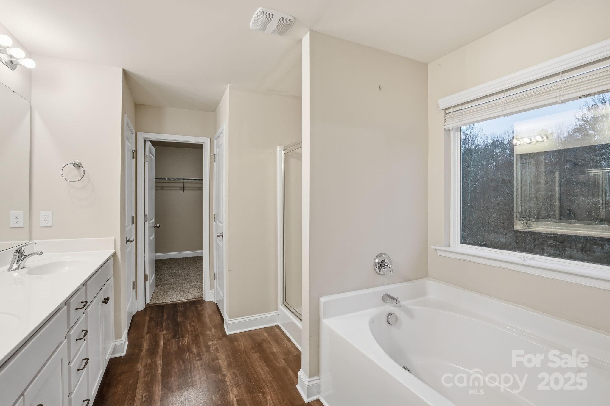 182 Sassafras Road Mooresville, NC 28115 - Photo 38 of 47 a bathroom with a bathtub shower and a sink