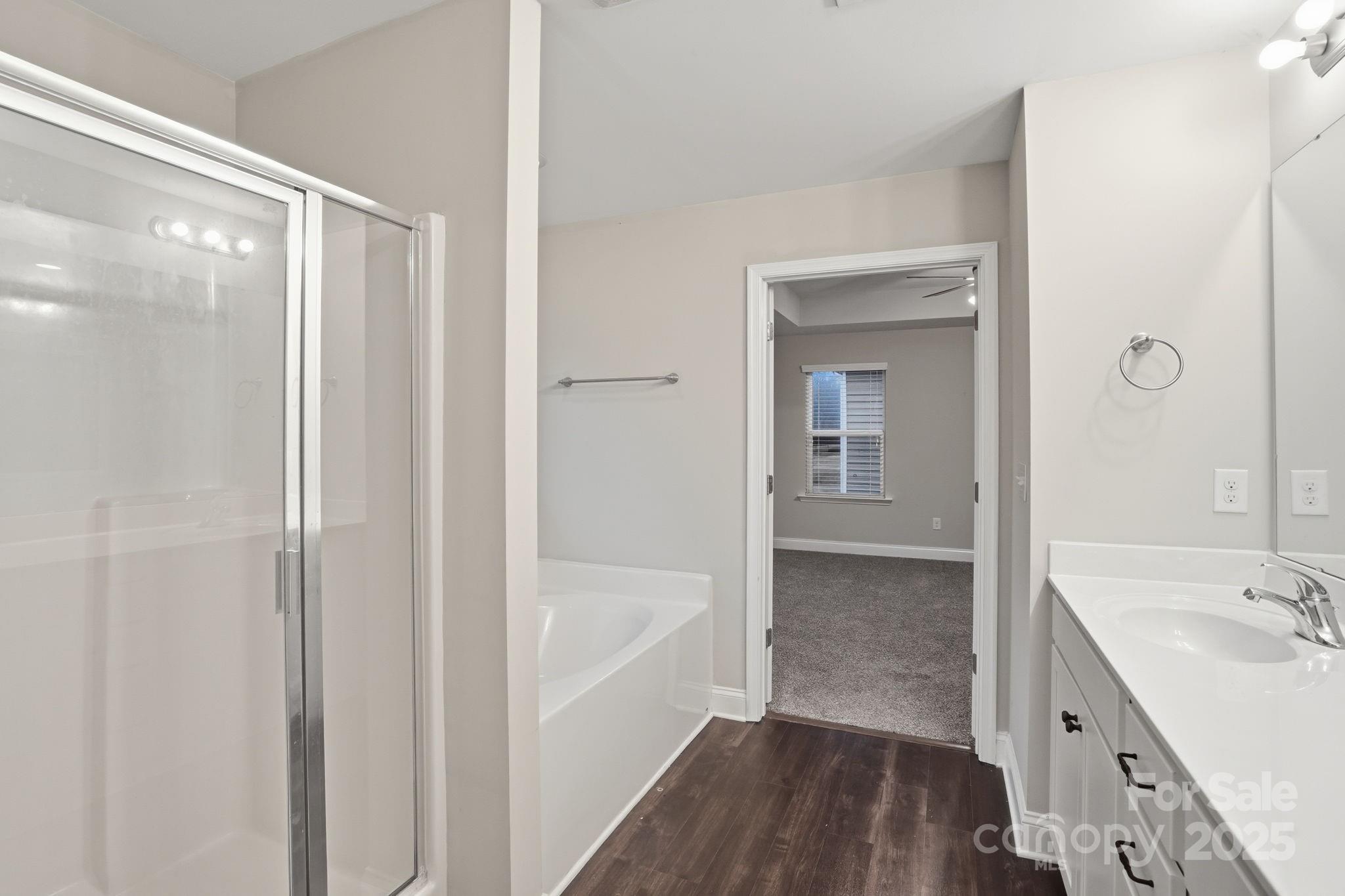 182 Sassafras Road Mooresville, NC 28115 - Photo 39 of 47 a bathroom with a tub sink and mirror