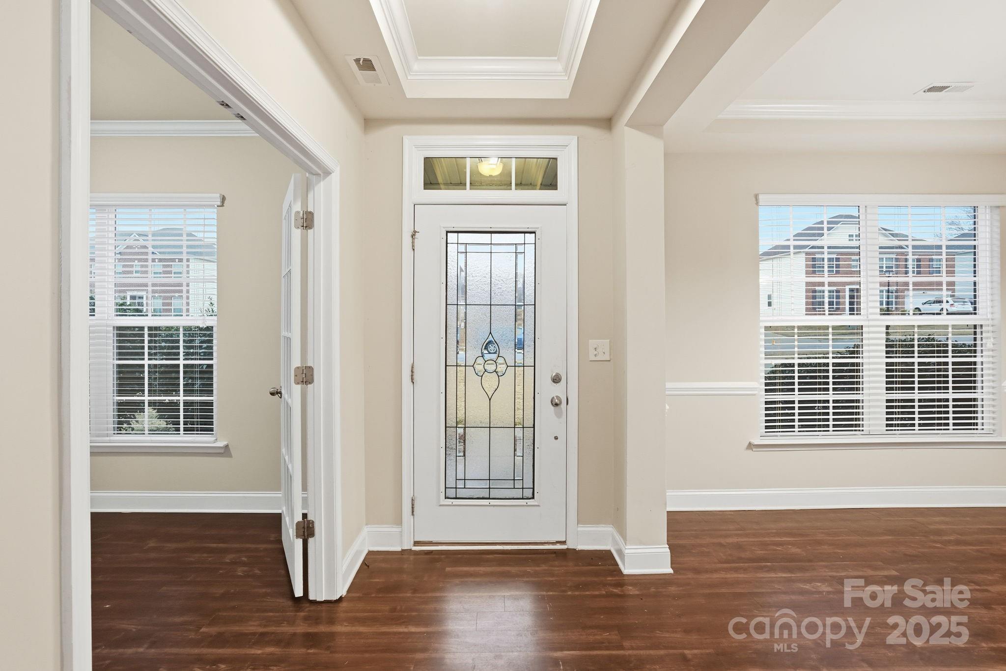 182 Sassafras Road Mooresville, NC 28115 - Photo 4 of 47 an empty room with wooden floor and windows