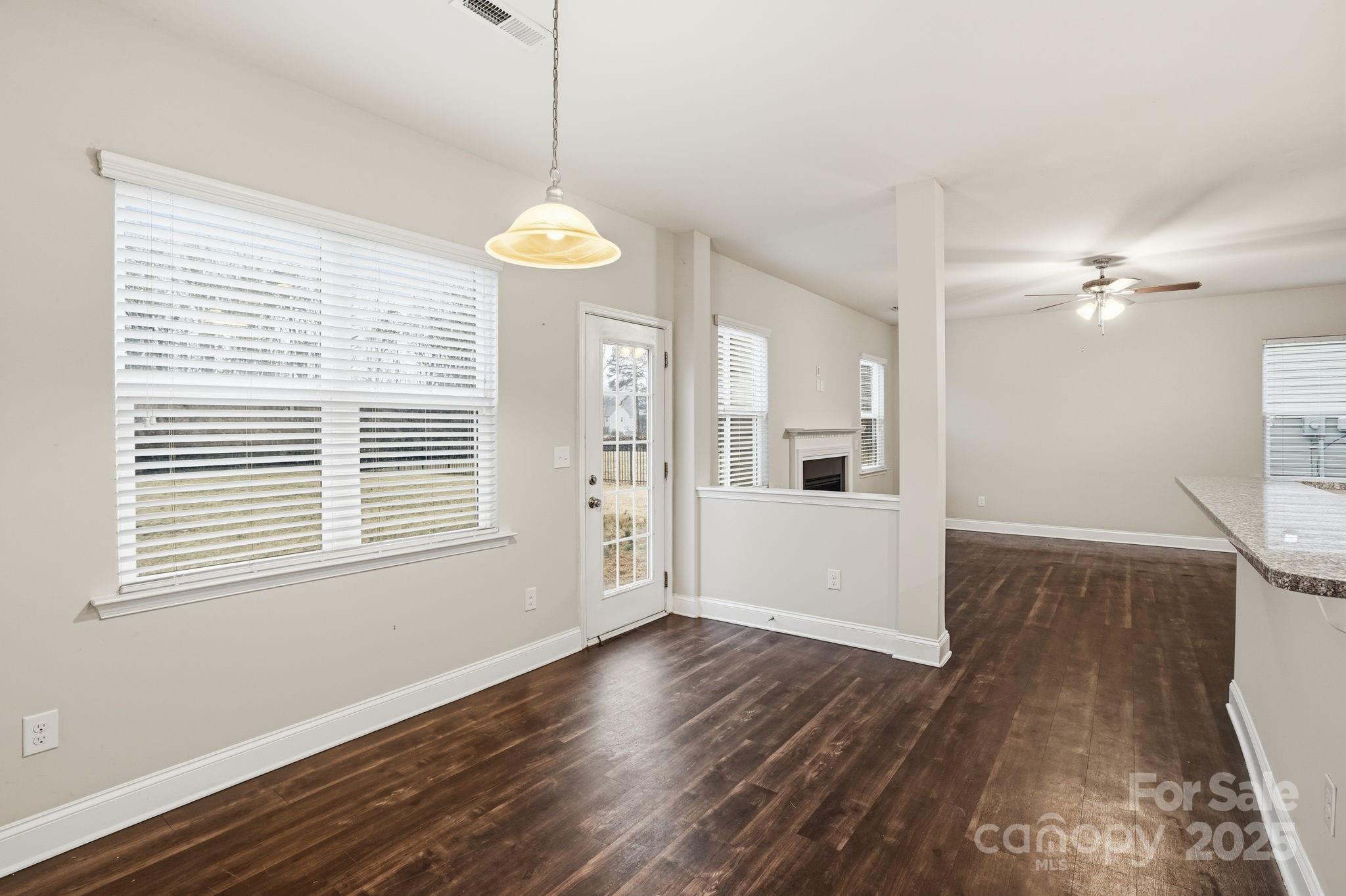 182 Sassafras Road Mooresville, NC 28115 - Photo 5 of 47 a view of a room with wooden floor and windows