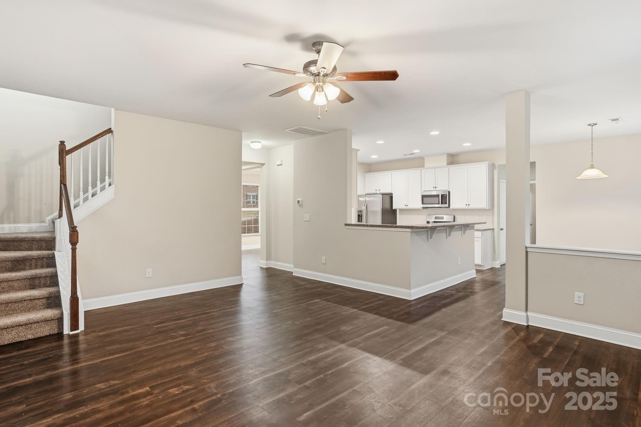 182 Sassafras Road Mooresville, NC 28115 - Photo 6 of 47 a view of a kitchen with wooden floor and a kitchen
