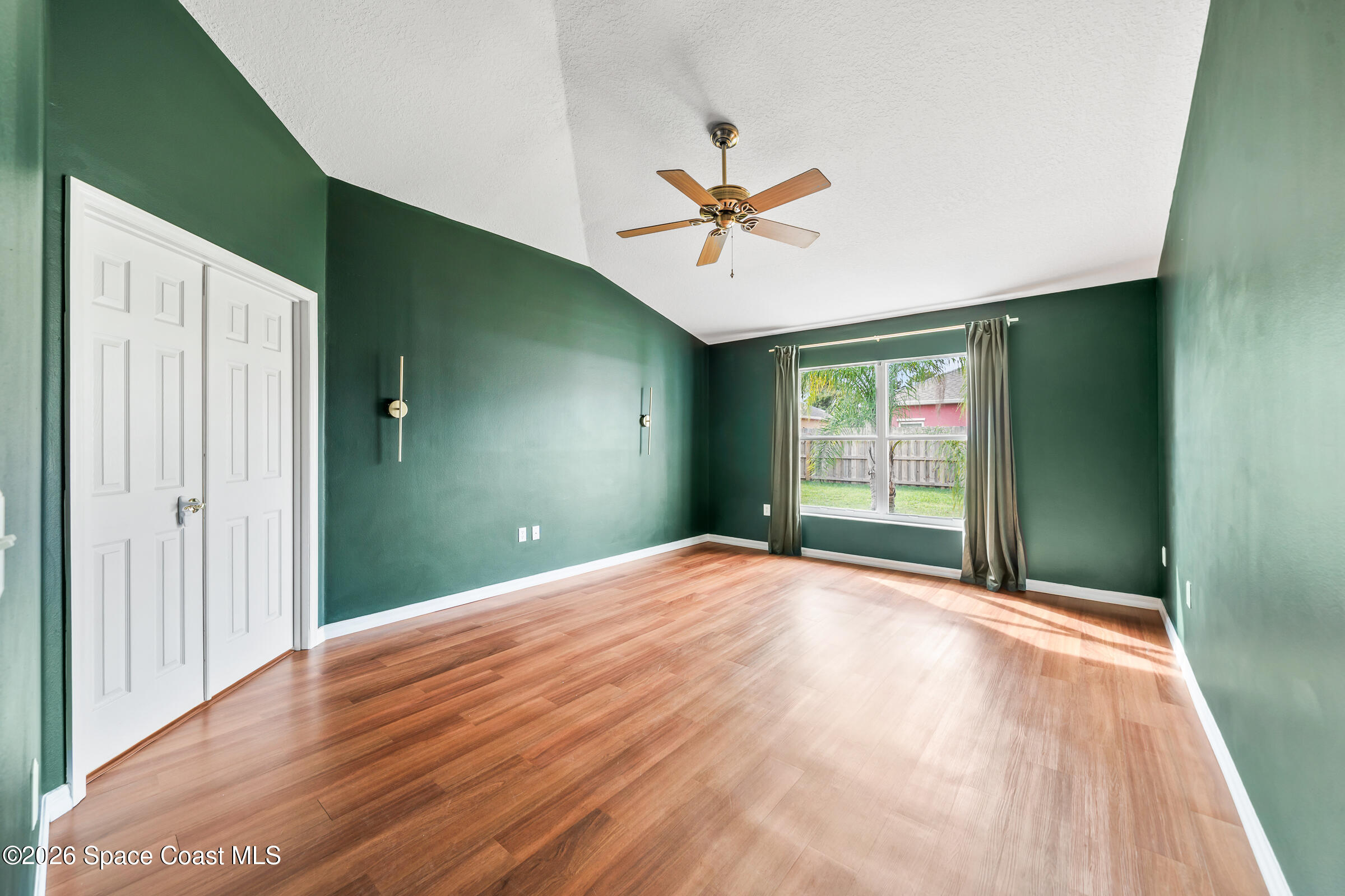 332 Brookcrest Circle Rockledge, FL 32955 - Photo 20 of 38 a view of a livingroom with a ceiling fan and window