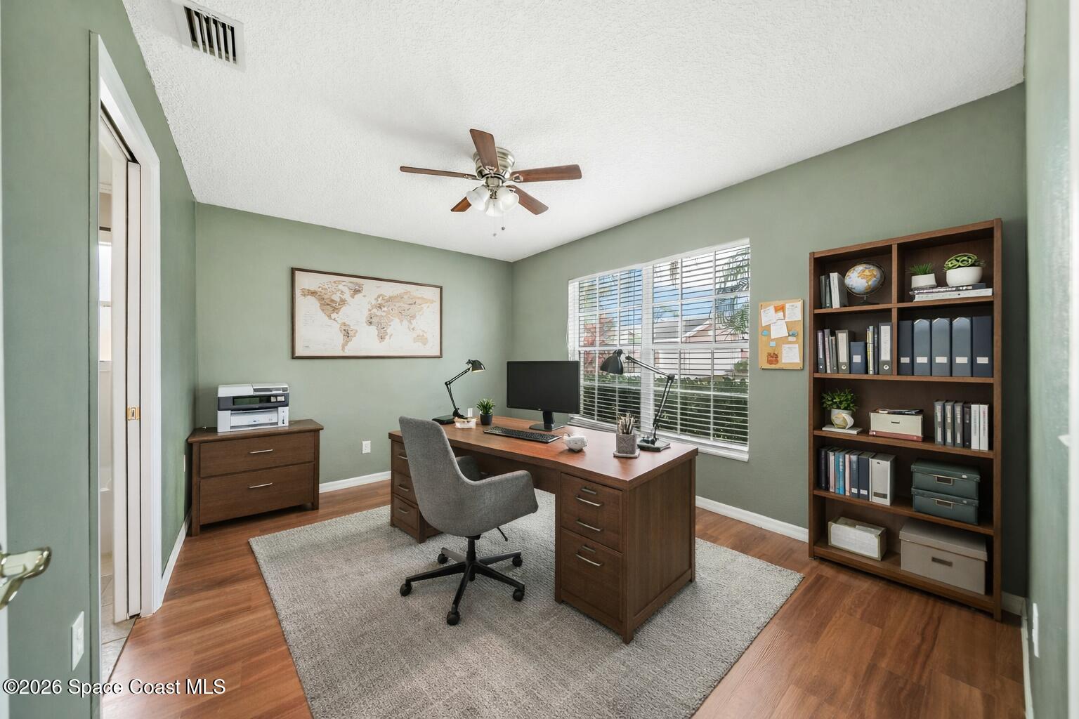 332 Brookcrest Circle Rockledge, FL 32955 - Photo 27 of 38 a workspace with furniture window and wooden floor