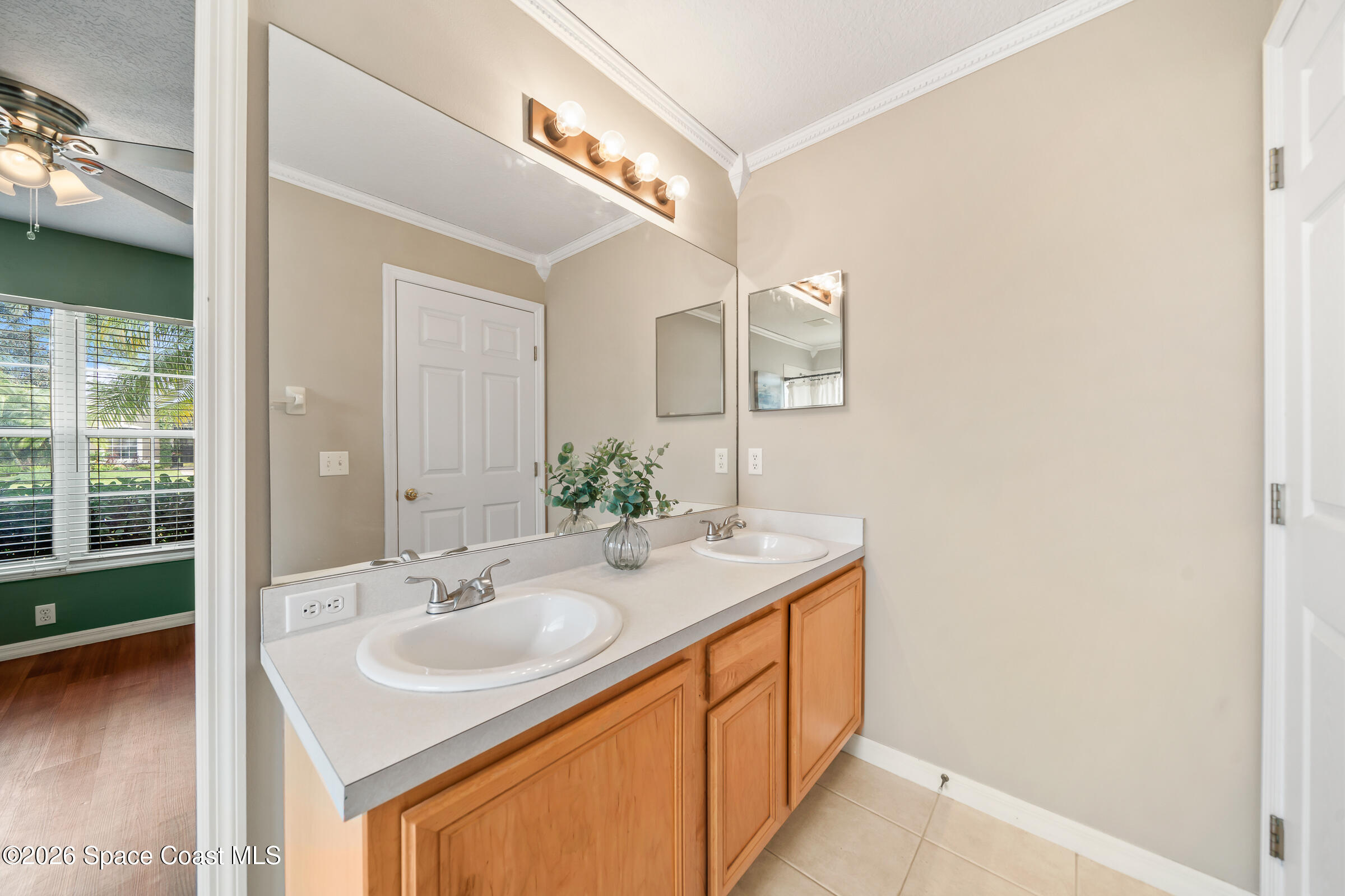 332 Brookcrest Circle Rockledge, FL 32955 - Photo 28 of 38 a bathroom with a sink and a mirror