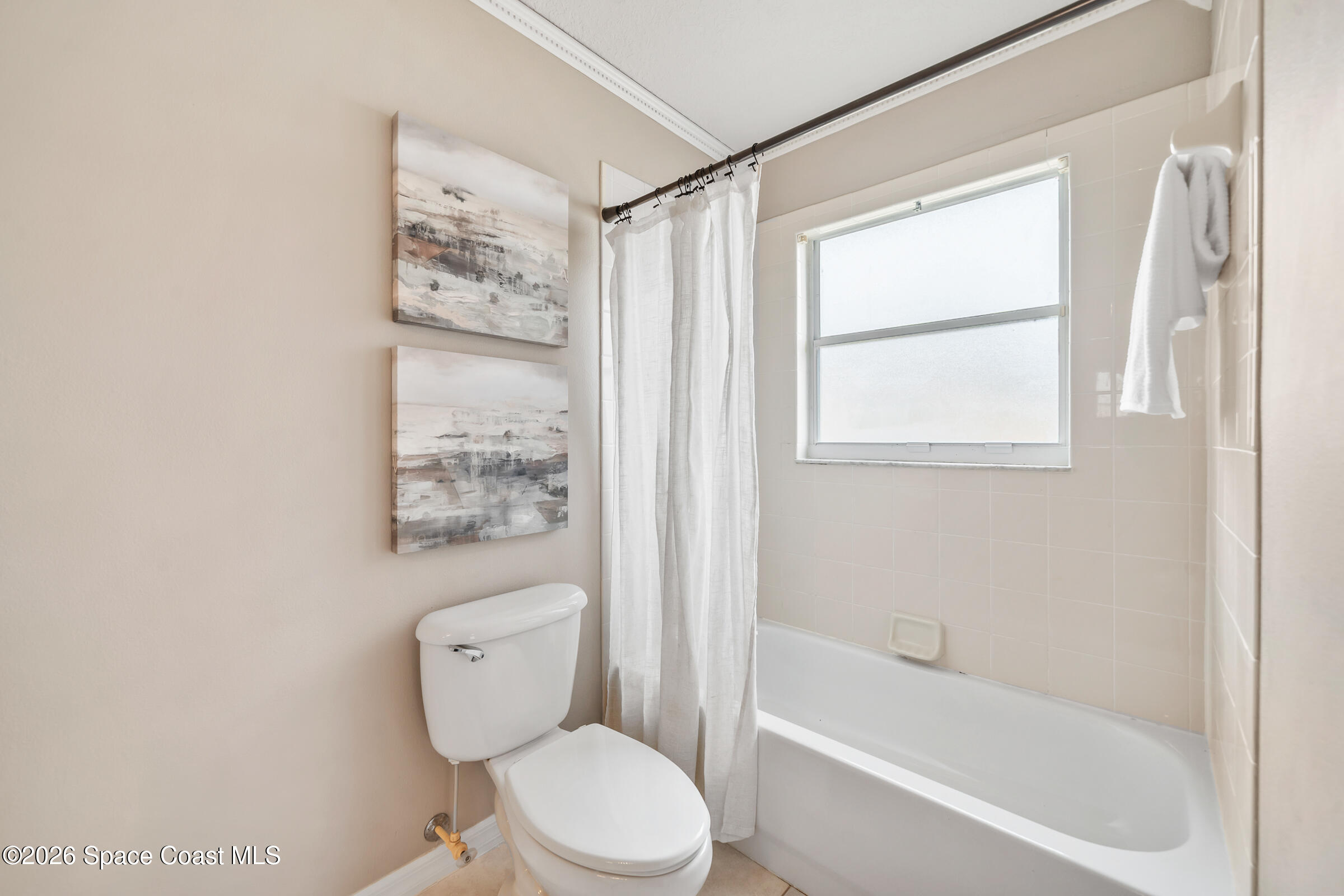 332 Brookcrest Circle Rockledge, FL 32955 - Photo 29 of 38 a white toilet sitting next to a bath tub shower