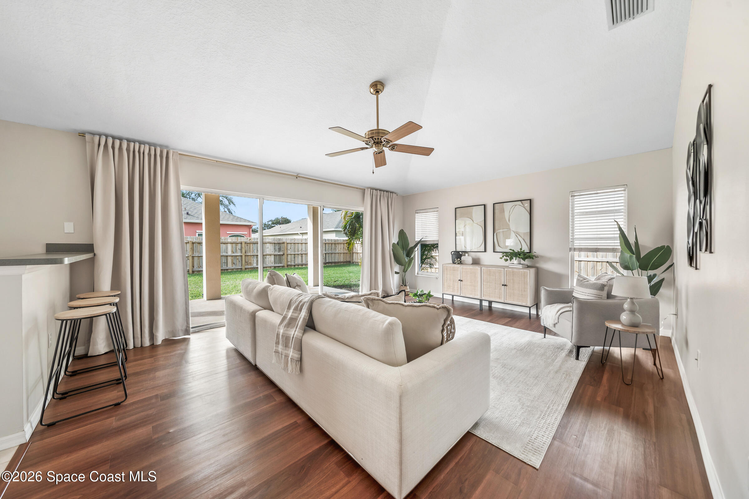 332 Brookcrest Circle Rockledge, FL 32955 - Photo 9 of 38 a living room with furniture and a large window