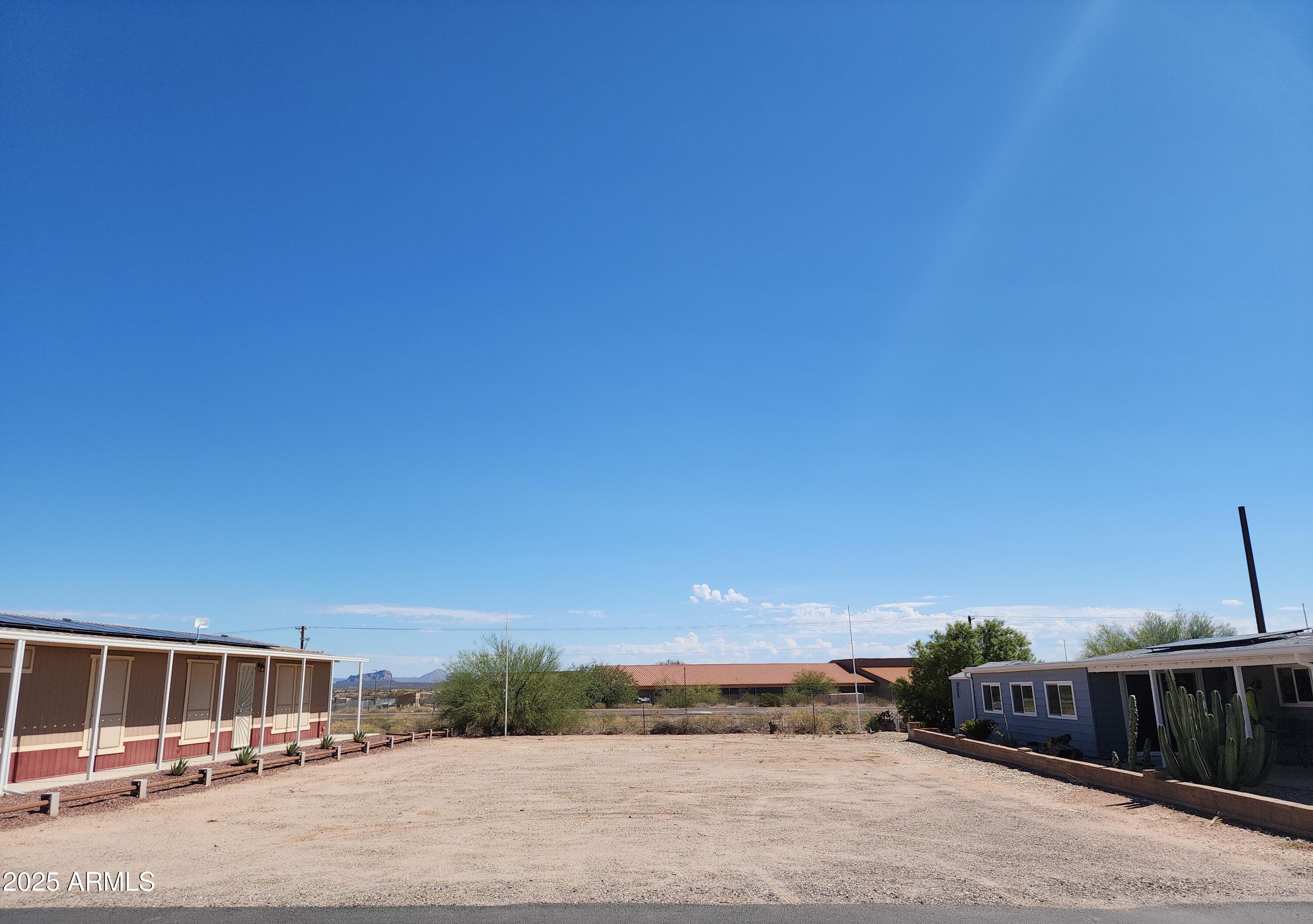 3603 North Colorado Avenue, Unit 914 Florence, AZ 85132 - Photo 1 of 11 a view of a street with house in the background
