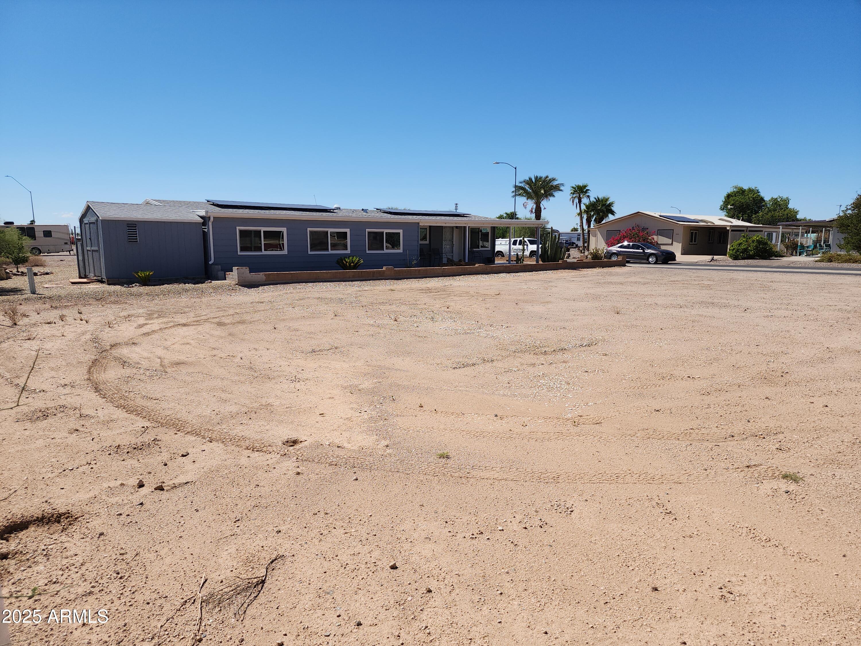 3603 North Colorado Avenue, Unit 914 Florence, AZ 85132 - Photo 3 of 11 a front view of a house with a yard