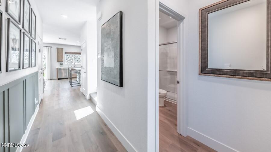 523 Daisy Fay Way Carson City, NV 89705 - Photo 3 of 28 a view of a hallway with wooden floor and staircase