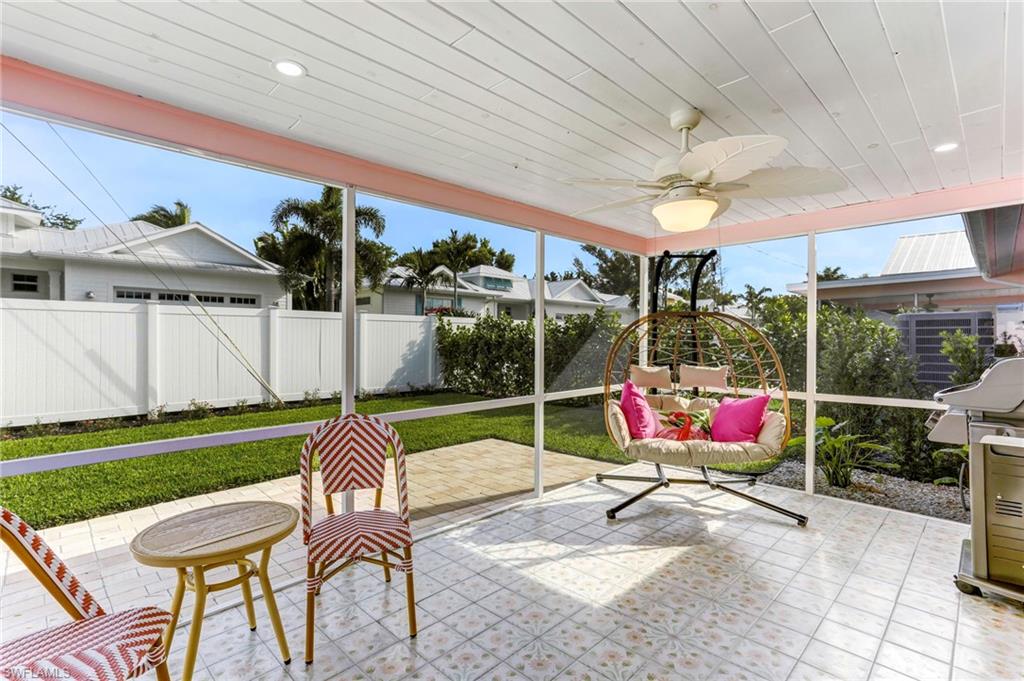 a patio area with table and chairs
