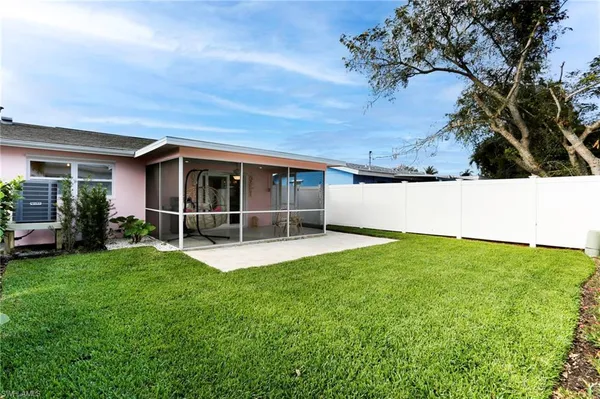 a view of an house with backyard space and garden