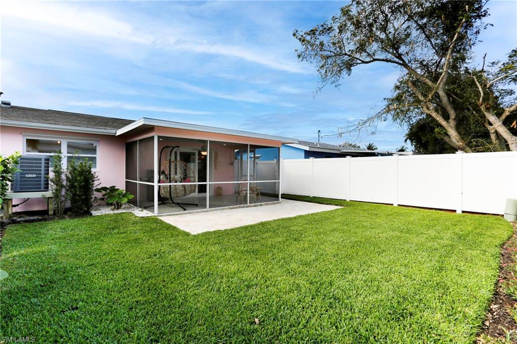 1793 Smugglers Cove, Unit B Naples, FL 34112 - Photo 18 of 24 a view of an house with backyard space and garden