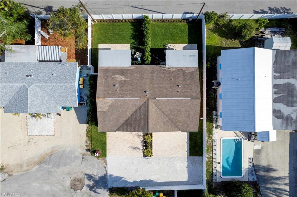 1793 Smugglers Cove, Unit B Naples, FL 34112 - Photo 22 of 24 an aerial view of residential houses with outdoor space