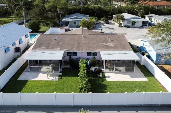 an aerial view of a house with garden and patio