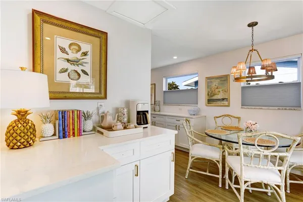 a kitchen with a table and chairs in it