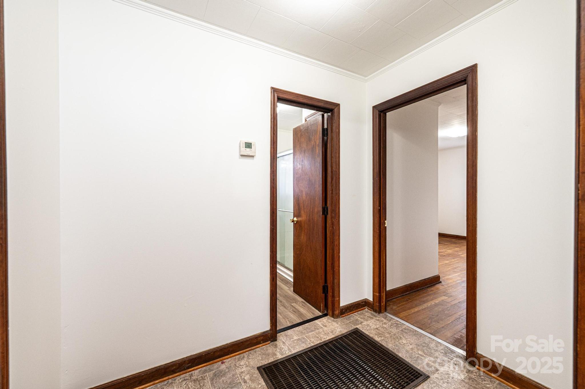 1214 Dry Ponds Road Granite Falls, NC 28630 - Photo 12 of 39 a view of a hallway with wooden floor and closet