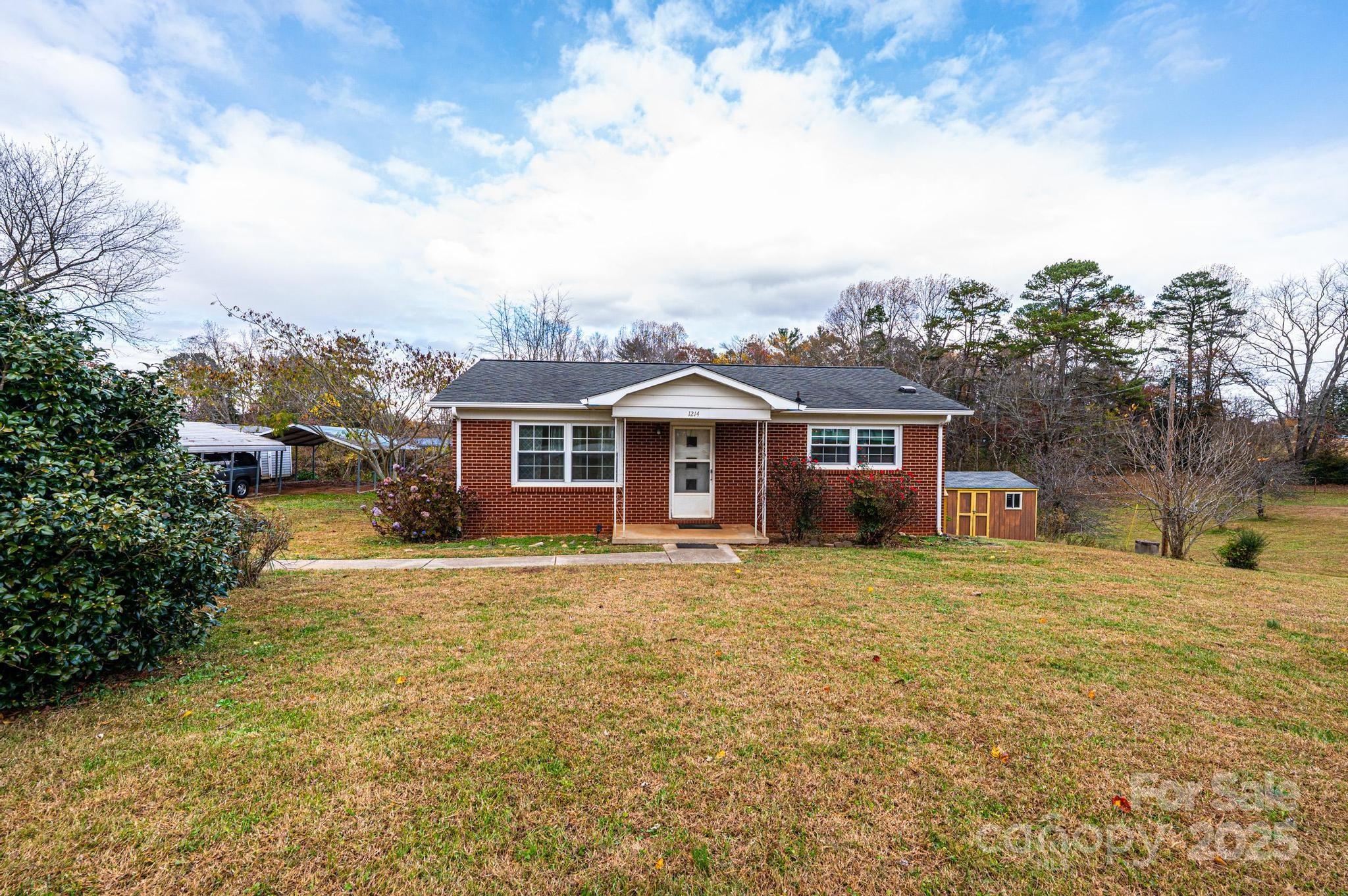 1214 Dry Ponds Road Granite Falls, NC 28630 - Photo 2 of 39 a front view of a house with a yard