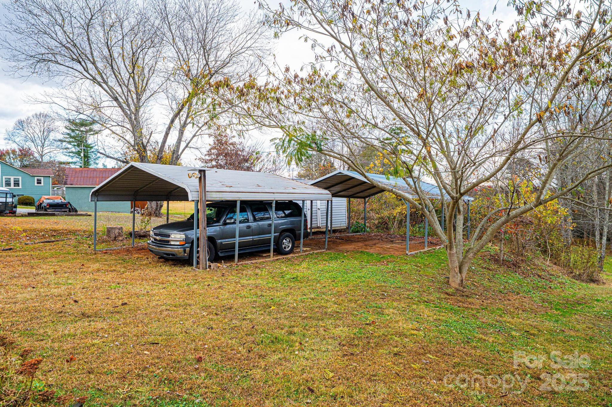 1214 Dry Ponds Road Granite Falls, NC 28630 - Photo 24 of 39 a view of a house with swimming pool and sitting area