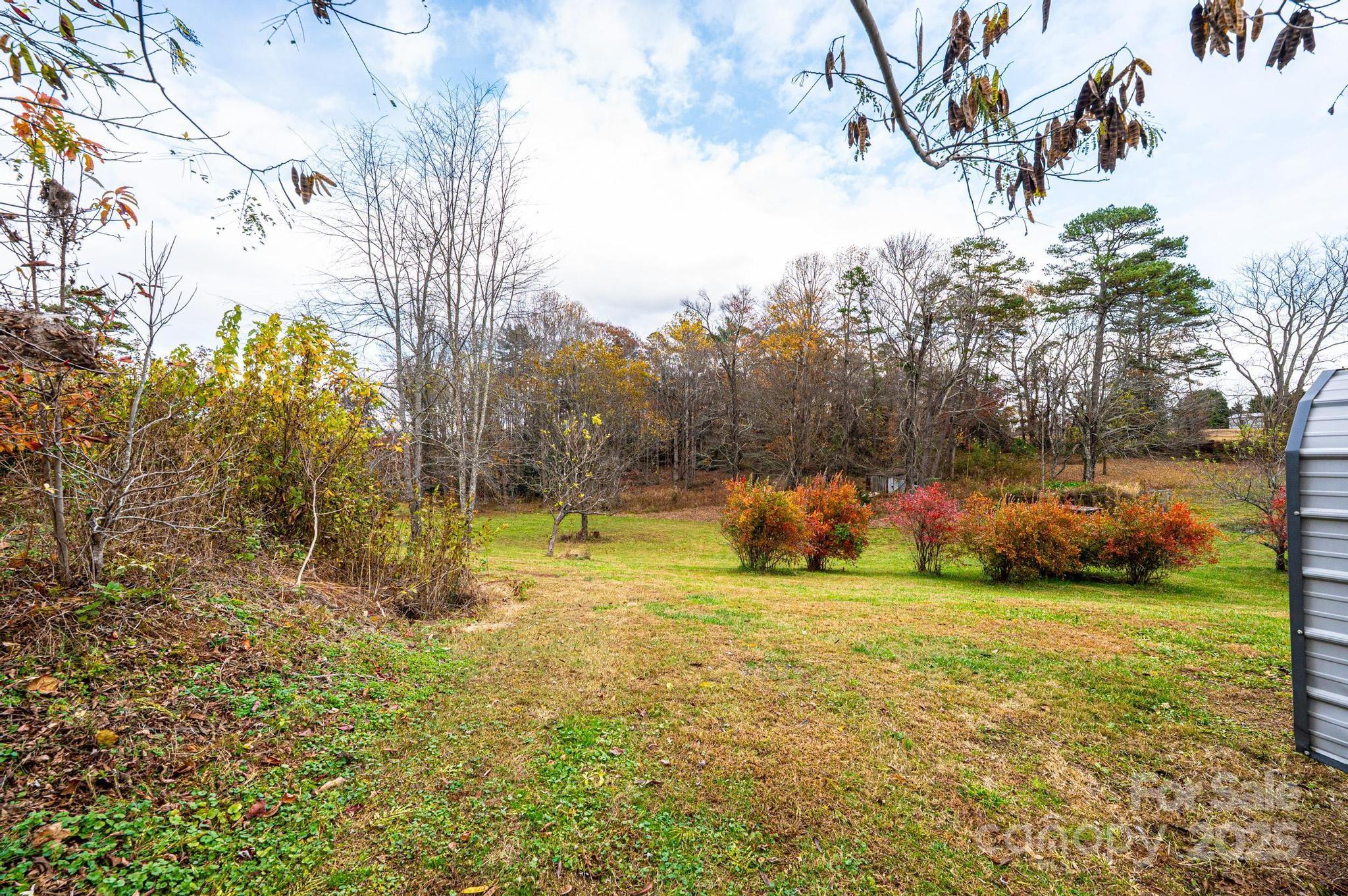 1214 Dry Ponds Road Granite Falls, NC 28630 - Photo 26 of 39 a view of a field of grass and trees