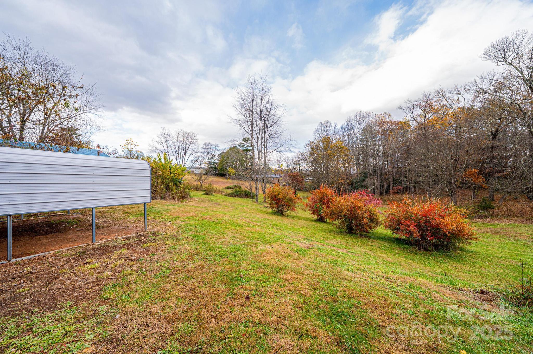 1214 Dry Ponds Road Granite Falls, NC 28630 - Photo 30 of 39 a view of a yard with an outdoor space