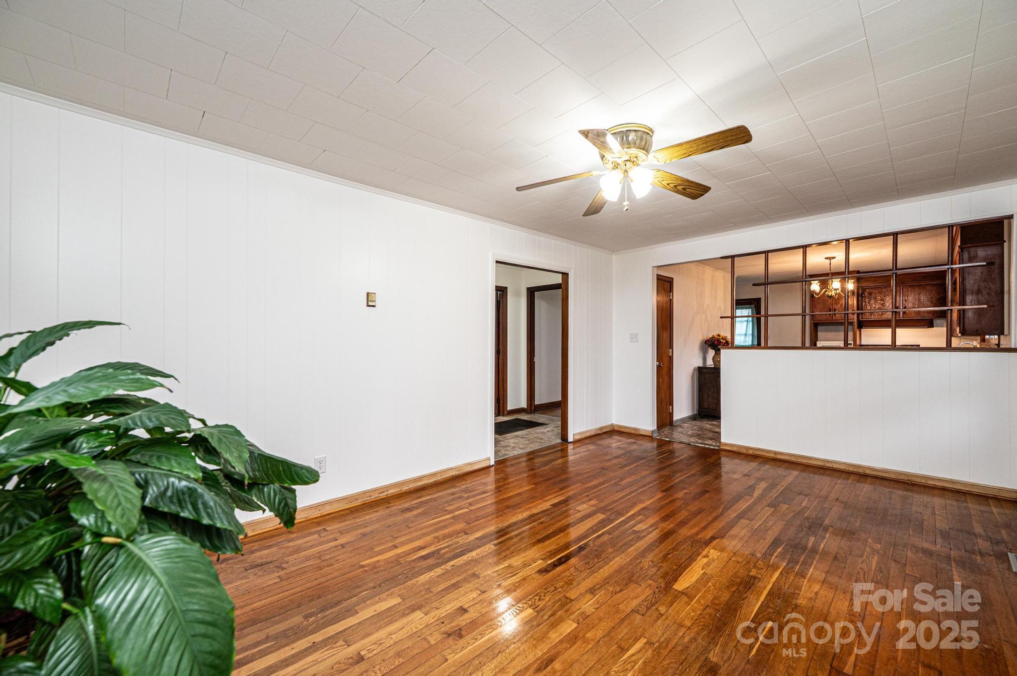 1214 Dry Ponds Road Granite Falls, NC 28630 - Photo 3 of 39 a view of an empty room with window and wooden floor