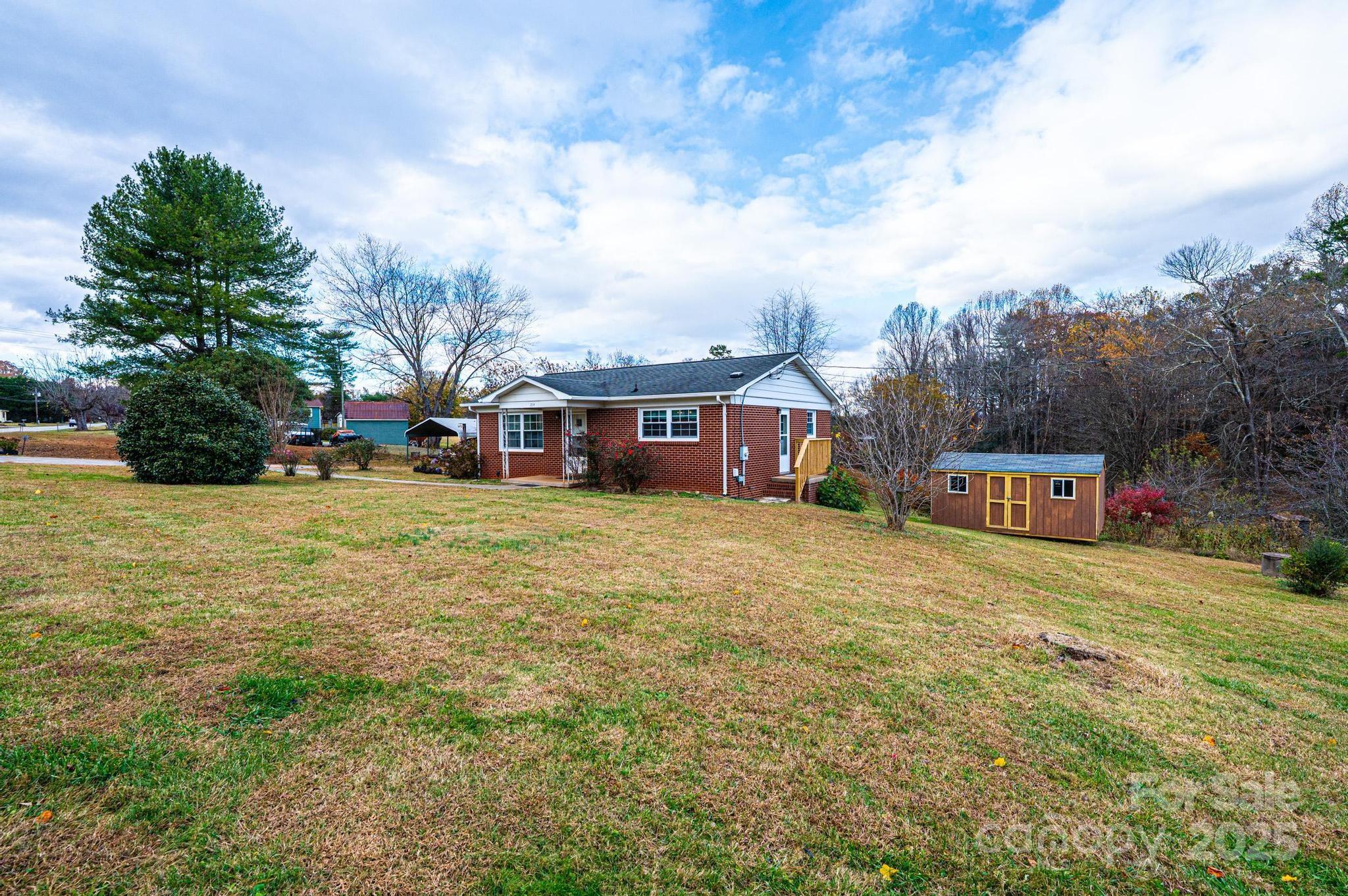 1214 Dry Ponds Road Granite Falls, NC 28630 - Photo 36 of 39 a front view of house with yard and trees around