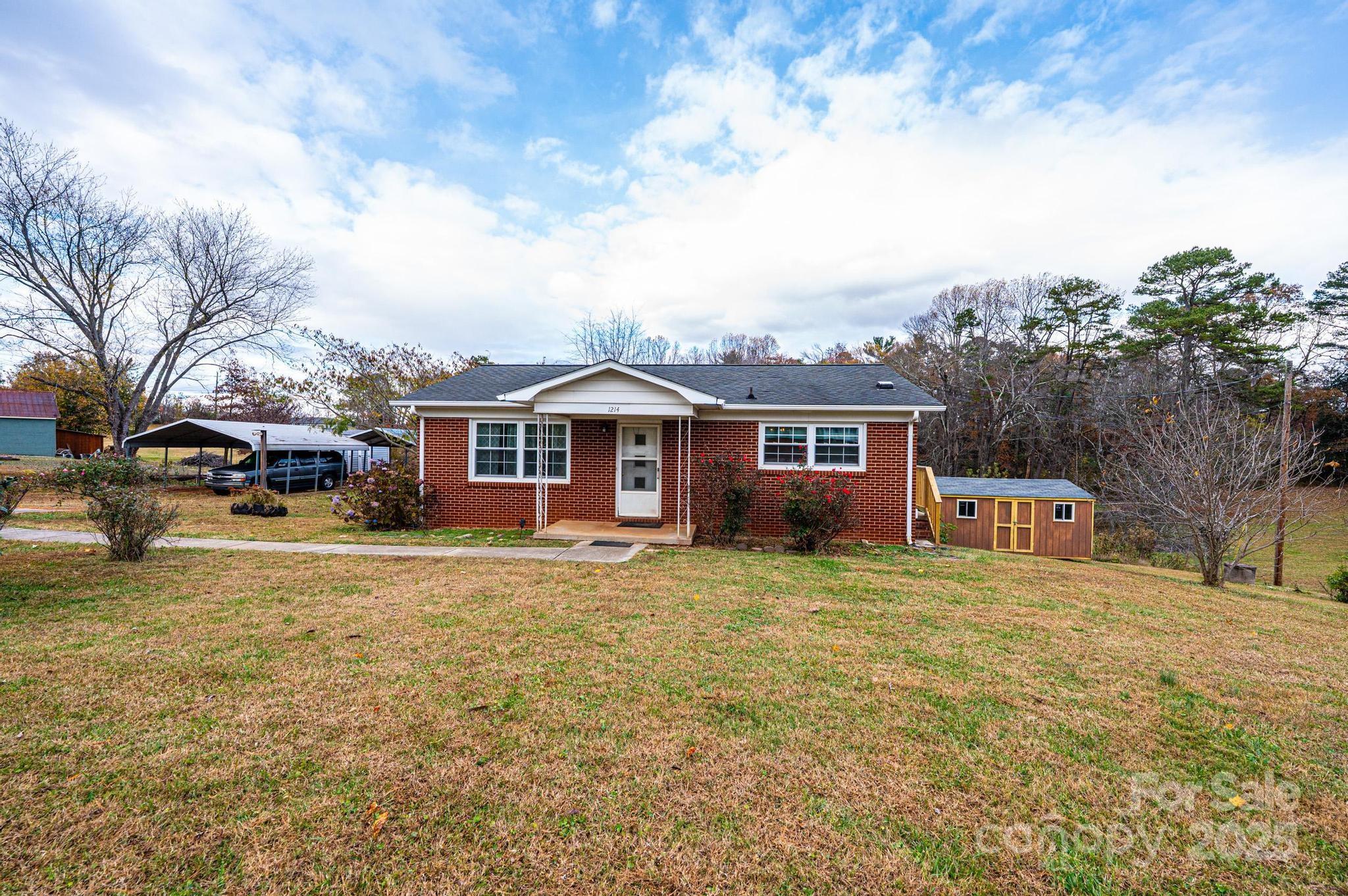 1214 Dry Ponds Road Granite Falls, NC 28630 - Photo 38 of 39 a front view of a house with a yard