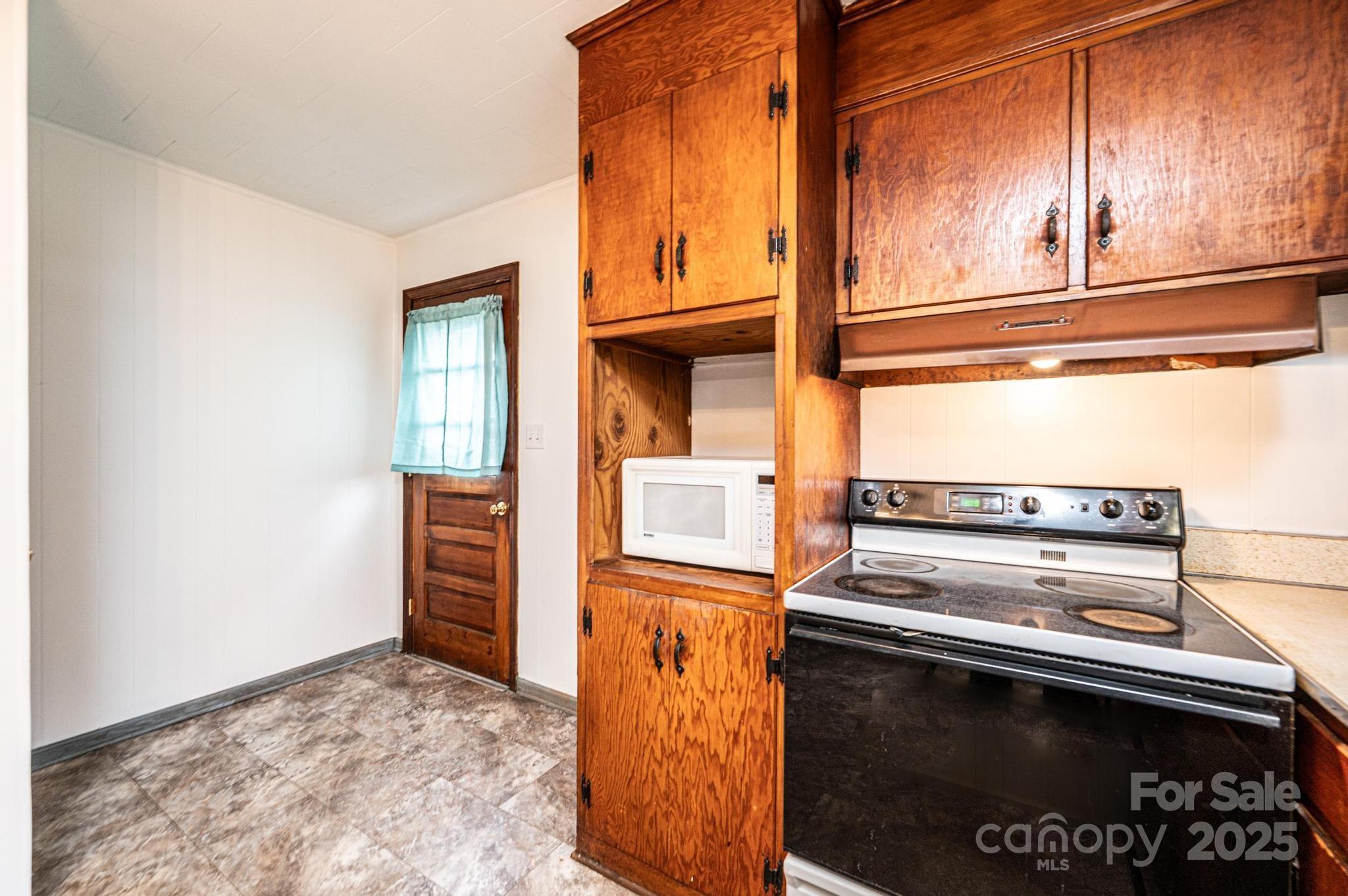 1214 Dry Ponds Road Granite Falls, NC 28630 - Photo 9 of 39 a view of kitchen with wooden floor