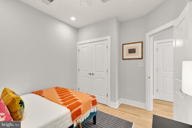 a balcony with table and chairs