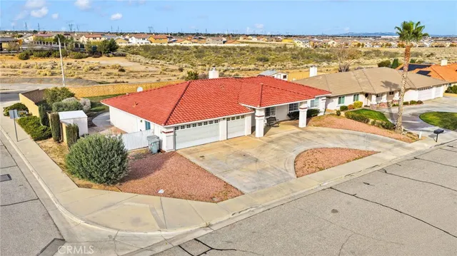 an aerial view of residential houses and outdoor space