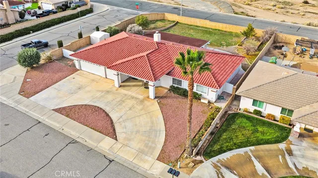 an aerial view of residential houses and outdoor space