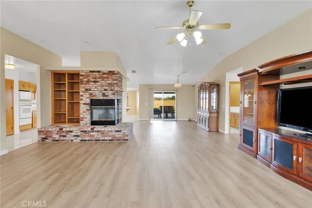 a living room with fireplace furniture and a flat screen tv