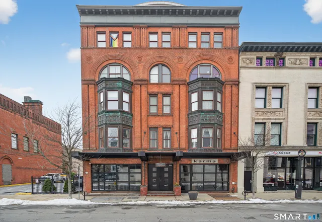a view of living room with furniture and a flat screen tv