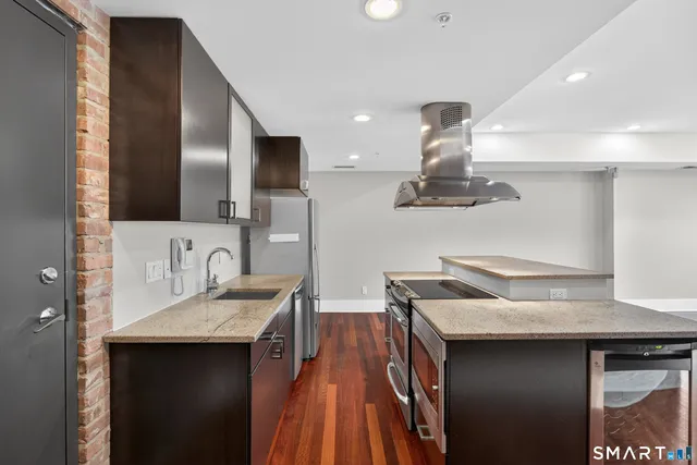 a kitchen with a sink and a refrigerator